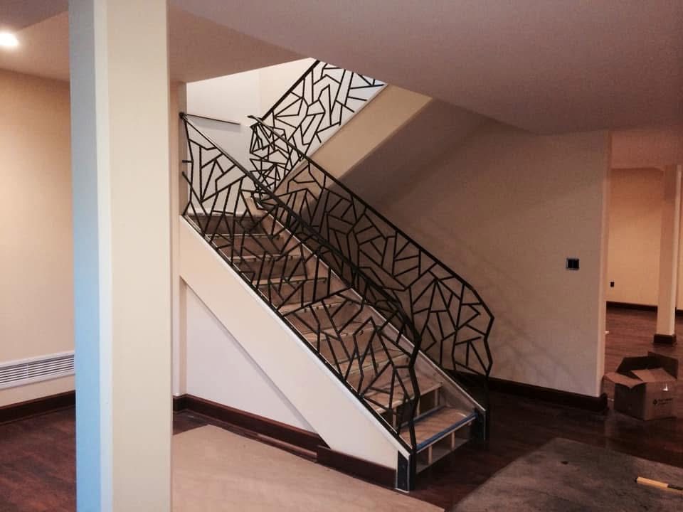 Custom laser-cut metal handrail installed on residential property in North Idaho by The High Road Manufacturing