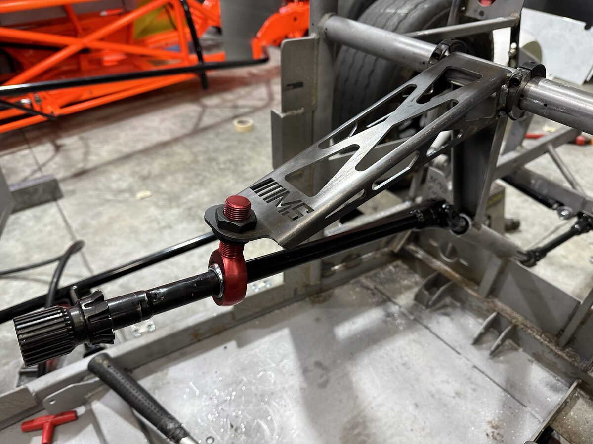 Custom suspension link arm installed on chassis assembly at The High Road Manufacturing