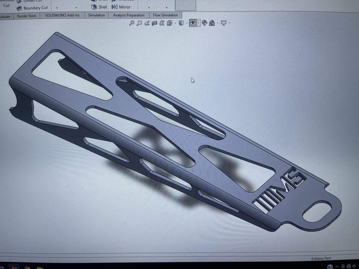SolidWorks 3D CAD model of custom suspension link arm designed at The High Road Manufacturing