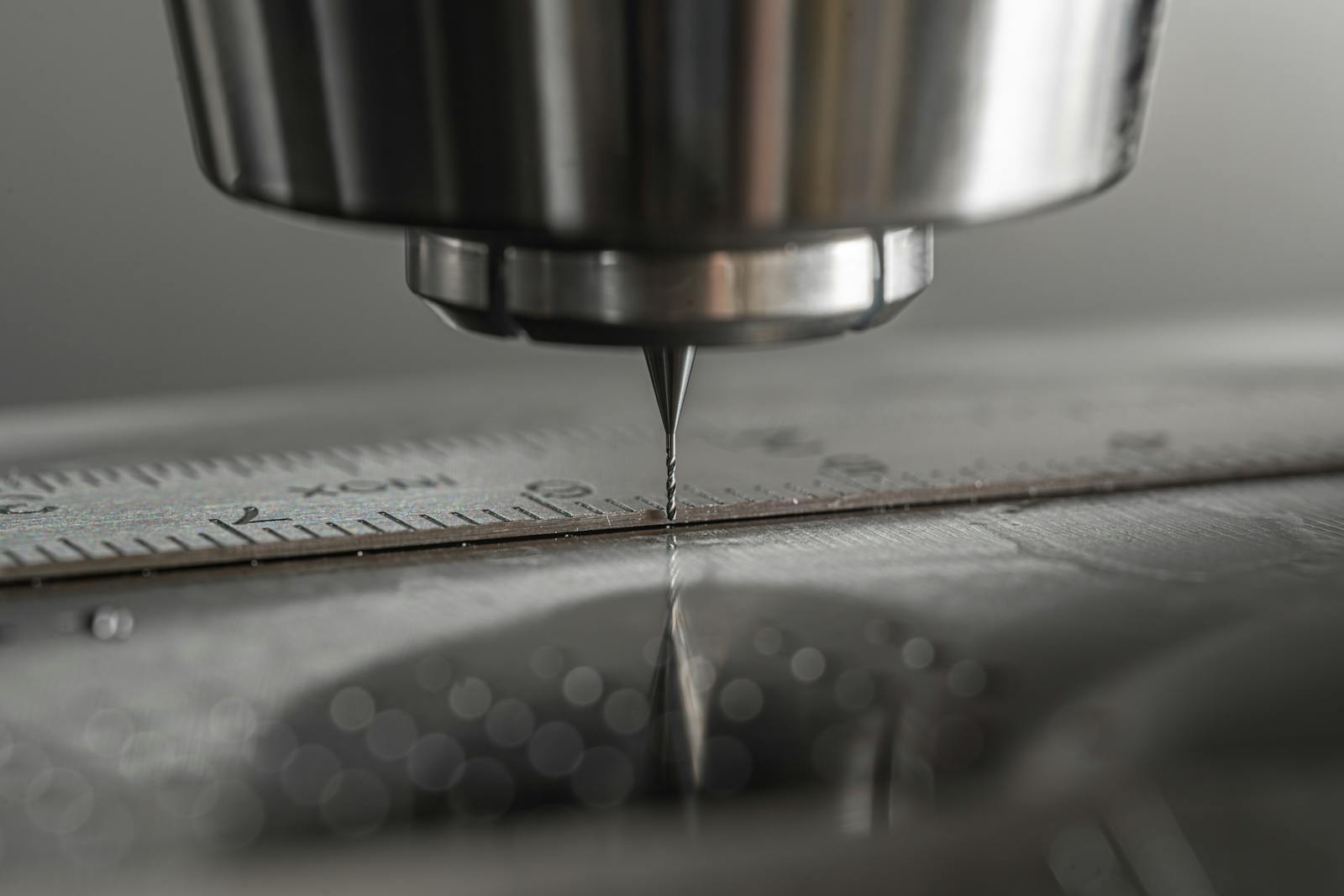 CNC milling machine spindle performing precision machining on a metal workpiece at The High Road Manufacturing
